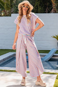 Ensemble femme avec haut et pantalon large à pompons